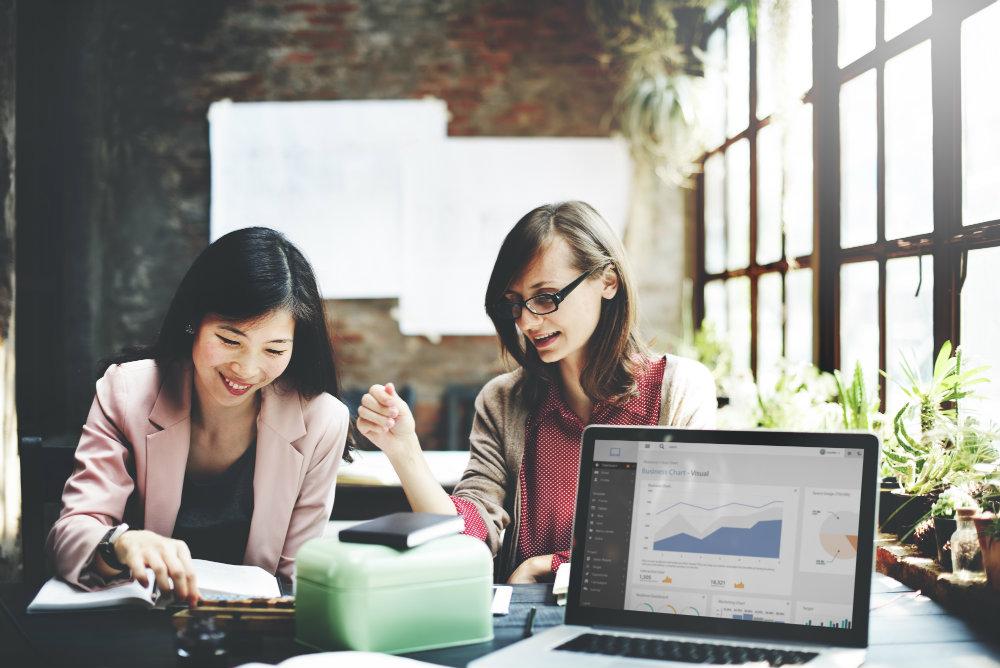 2 Women discussing mktg iStock 521987994